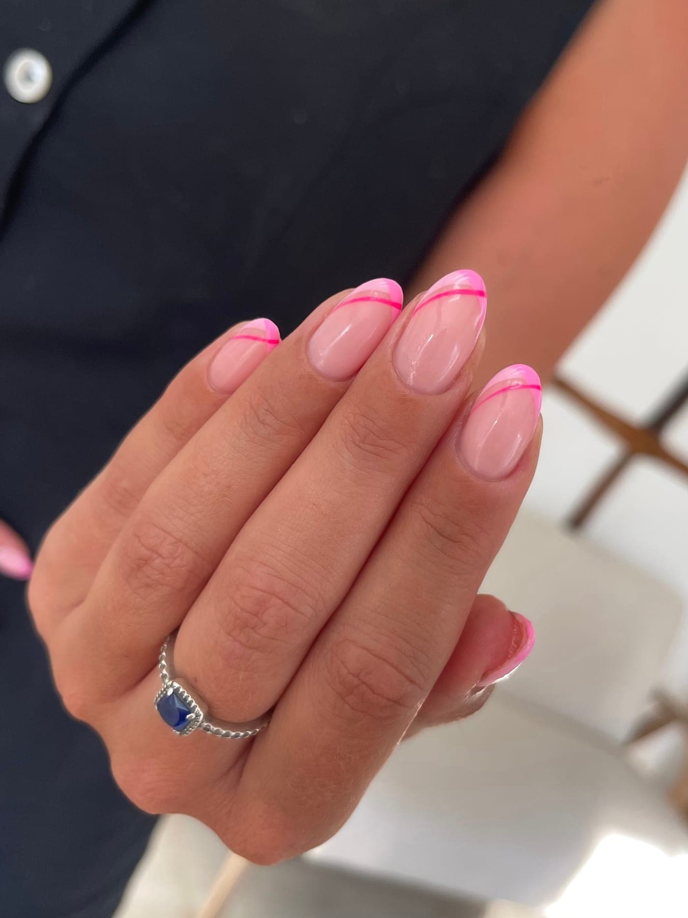 Glossy pink french tip gel polish nails, painted at CREATE